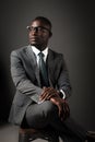 Serious young black man with glasses and gray business suit Royalty Free Stock Photo