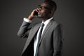 Serious young black man with glasses and gray business suit talk Royalty Free Stock Photo