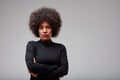 Serious young Black woman with lip piercing and curly hair Royalty Free Stock Photo