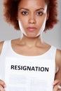 Serious young Black woman tendering her resignation Royalty Free Stock Photo