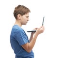 Serious young boy with a small notebook computer