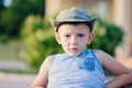 Serious Young Boy Wearing Tank Top and Hat Royalty Free Stock Photo