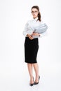 Serious young business woman standing and holding folders Royalty Free Stock Photo