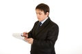 Serious young businessman making notes in document Royalty Free Stock Photo