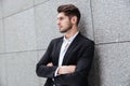 Serious young businessman standing with arms crossed Royalty Free Stock Photo