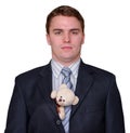 Serious Young Businessman with Teddy Bear in Suit Royalty Free Stock Photo