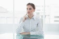 Serious young businesswoman sitting at her desk Royalty Free Stock Photo