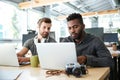 Serious young colleagues sitting in office coworking Royalty Free Stock Photo