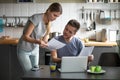 Serious young couple worried discussing utility bills in the kit Royalty Free Stock Photo