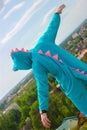 Serious young handsome man in crocodile costume near castle wall Royalty Free Stock Photo