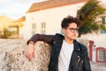 Serious young man contemplating standing against a city Royalty Free Stock Photo