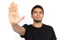 Serious young man showing stop sign Royalty Free Stock Photo