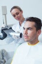 Serious young man undergoing dental checkup Royalty Free Stock Photo