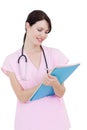 Serious young nurse taking notes Royalty Free Stock Photo