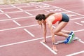 Serious young woman preparing for jogging Royalty Free Stock Photo