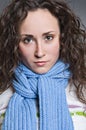 Serious young woman in scarf