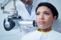 Serious young woman undergoing dental checkup Royalty Free Stock Photo
