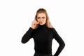 Serious young woman zipping her mouth shut, show taboo hush gesture and frowning, be quiet. Keeping quiet concept Royalty Free Stock Photo