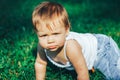 Seriously gloomy angry baby looking at the camera Royalty Free Stock Photo