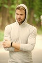 Seriousness and masculinity. sportswear fashion. sportsman relax after training outdoor. handsome unshaven man in hood