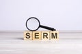 SERM word made with wooden blocks. can be used for business, marketing and education concept Royalty Free Stock Photo