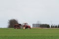 Serock, Poland - April 3, 2021: Horse on a trailer behind an old tractor on a country road against the background of spring green Royalty Free Stock Photo