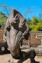 Serpent-like snake creature Phaya Naga statue in khmer ruins wat Royalty Free Stock Photo