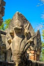 Serpent-like snake creature Phaya Naga statue in khmer ruins wat Royalty Free Stock Photo
