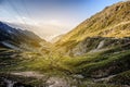 Serpentine curve mountain road shot from high point on sunset. Royalty Free Stock Photo