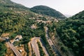 Serpentine roads in the mountains near a small village. Montenegro. Drone