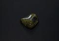 Serpentine stone isolated on black background Royalty Free Stock Photo