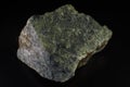 Serpentinite stone mineral on black background Royalty Free Stock Photo