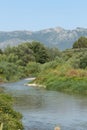 Serpis river as it passes through Alcocer de Planes and the Sierra de Mariola in the background