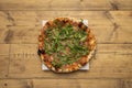 Serrana thin-crust pizza with Spanish ham and arugula cooked in a stone