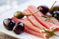Serrano ham with olives and caper berries