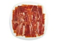 Serrano ham slices on a white dish. Jabugo Royalty Free Stock Photo