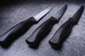 Serrated steak knives on black cutting board Royalty Free Stock Photo