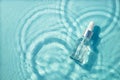 Serum bottle under water. Royalty Free Stock Photo