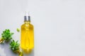 Serum with natural vitamin C, cosmetic oil in a glass bottle with a pipette. Llight background