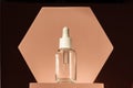 Serum product cosmetic with peptide and collagen on brown surface. Hyaluronic acid, serum skincare bottle on beige