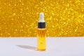 Serum skin care cosmetics on gold background, banner or template