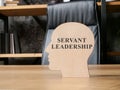 Servant leadership. The outline of the head stands on the office table.