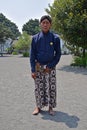 A servant of Yogyakarta Royal Palace Kraton posing in traditional attire
