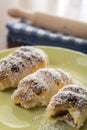 Served baked bun rolls with coconut on the plate with blurred background Royalty Free Stock Photo