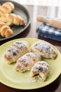 Served baked bun rolls with coconut on the plate with blurred background Royalty Free Stock Photo