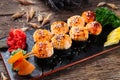 Served baked sushi rolls american style on plate Royalty Free Stock Photo