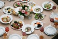 Served for banquet restaurant table with dishes, snack, cutlery, wine and water glasses, european food, selective focus Royalty Free Stock Photo