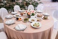 Served for banquet restaurant table with dishes, snack, cutlery, wine and water glasses, european food, selective focus Royalty Free Stock Photo