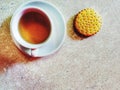 Cup of herbal tea,chocolate biscuit and half an orange served for breakfast Royalty Free Stock Photo