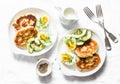 Served brunch table - potato scones and boiled eggs on a light background, top view. Delicious breakfast, snack Royalty Free Stock Photo